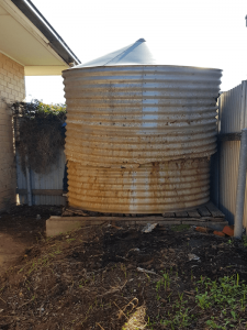 old rusted rainwater tank