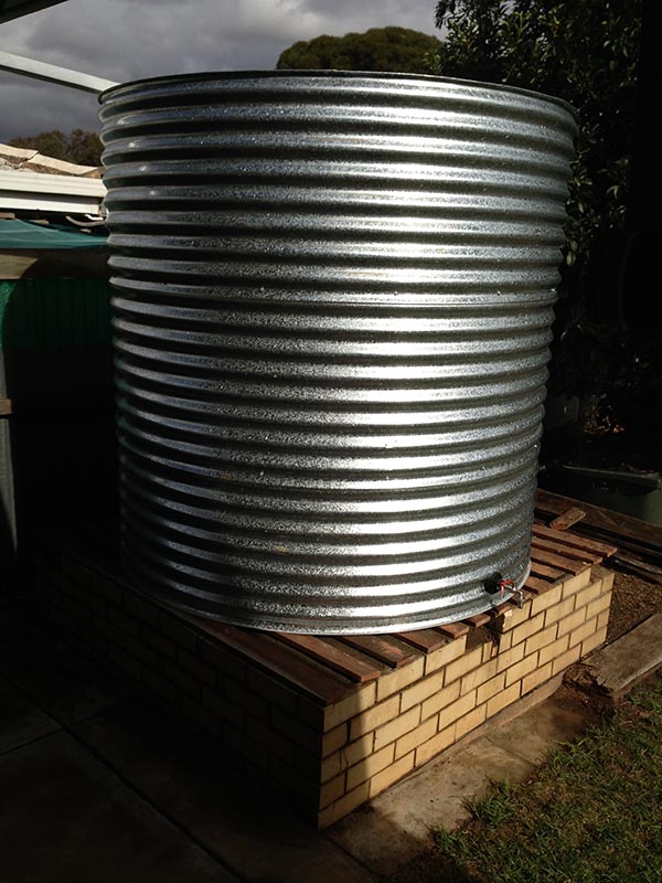 galvanised steel rainwater tank on existing base