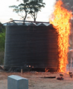 poly tank with fire and flames around it
