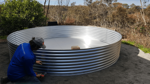 Base rung for rainwater tank with Steve putting it together