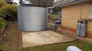 concrete base next to existing rainwater tank