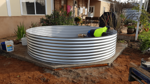Base rung for rainwater tank with Steve inside working