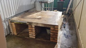 rainwater tank base made of bricks and concrete