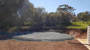 Gravel base for tank